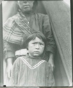 Image of Eskimo [Inuk] girl by mother